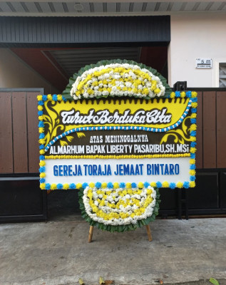 Papan Bunga Duka di Dringo